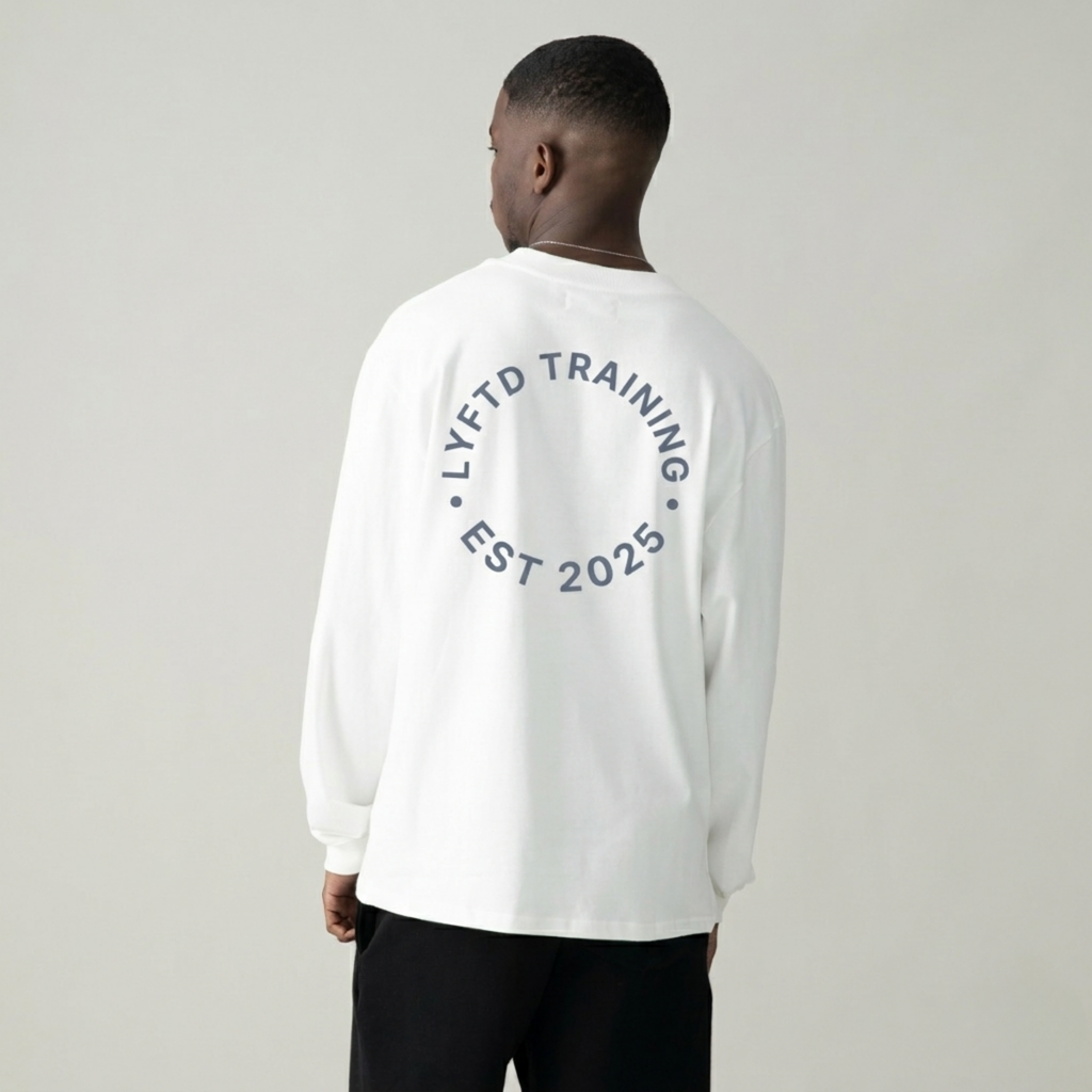 Man wearing a white sweatshirt with 'LYFTD' branding on a gray background